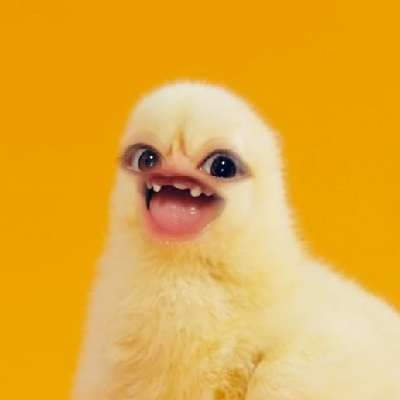 A baby chick with human eyes and mouth that's missing teeth.